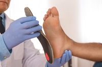 How Foot Orthotics Can Help Alleviate Pain From Flat Feet